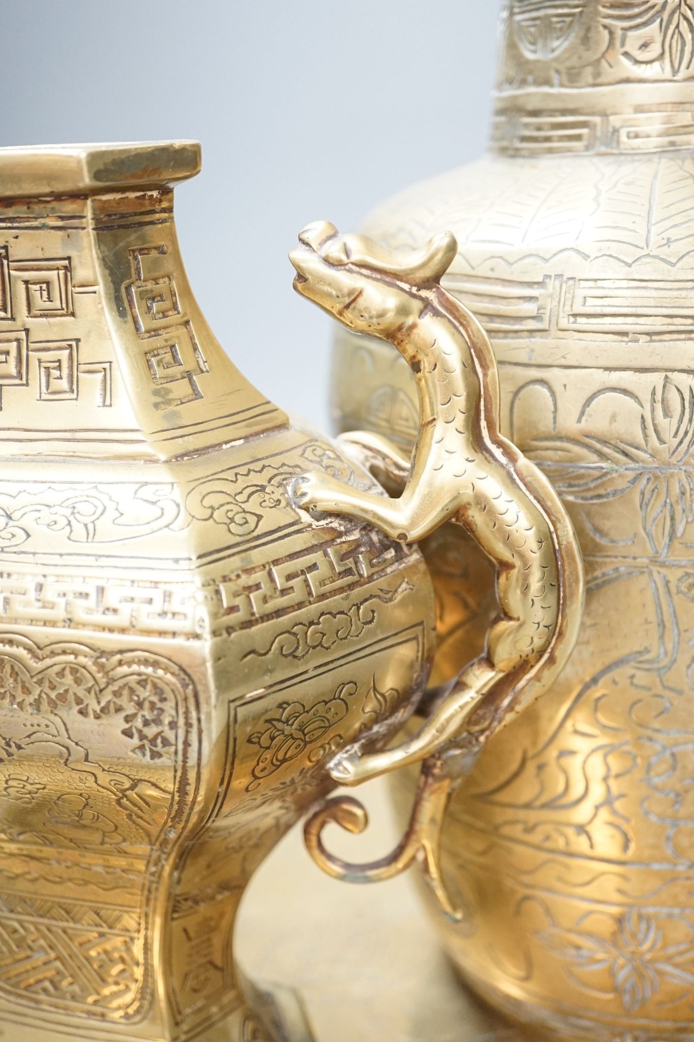 Two early 20th century Chinese bronze vases and a similar tray, 35cm diam.